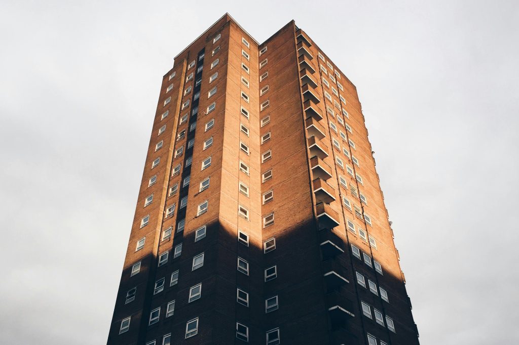A tall residential apartment building with a classic facade in Brighton, England.